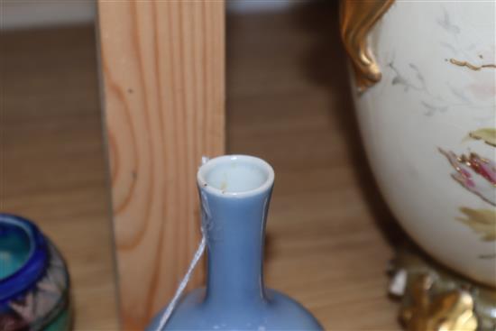 A Chinese blue glazed bottle vase, Kangxi mark but Republic period and a Chinese pottery figure tallest 12cm